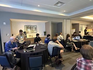 FloraPalooza participants listening to a presentation by OEB Postdoc Aaron Lee