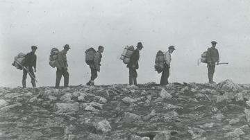 J.F. Collins with unidentified group, circa 1900